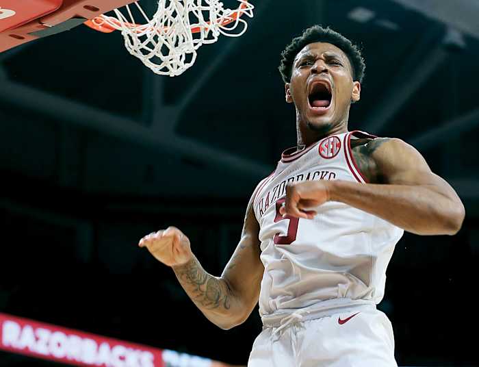 Arkansas Razorbacks guard Au'Diese Toney (5) celebrates after dunking the ball in the second half against the West Virginia Mountaineers at Bud Walton Arena. Arkansas won 77-68.